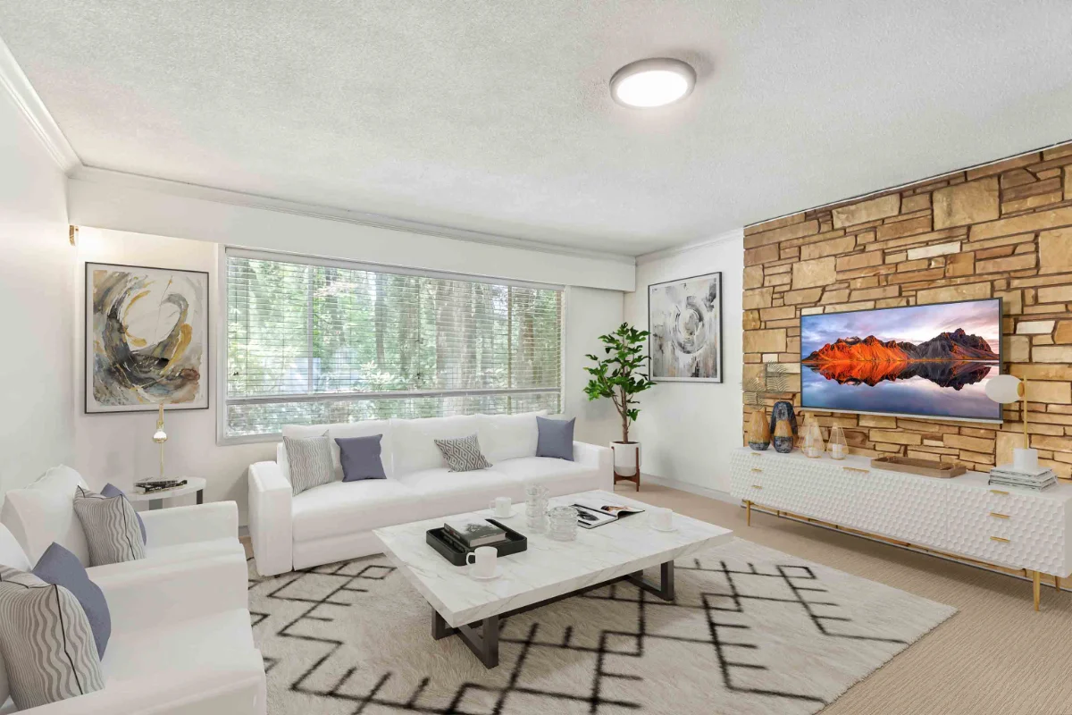 Cozy family room with plush sofa, accent chairs and warm lighting after virtual renovation transformation