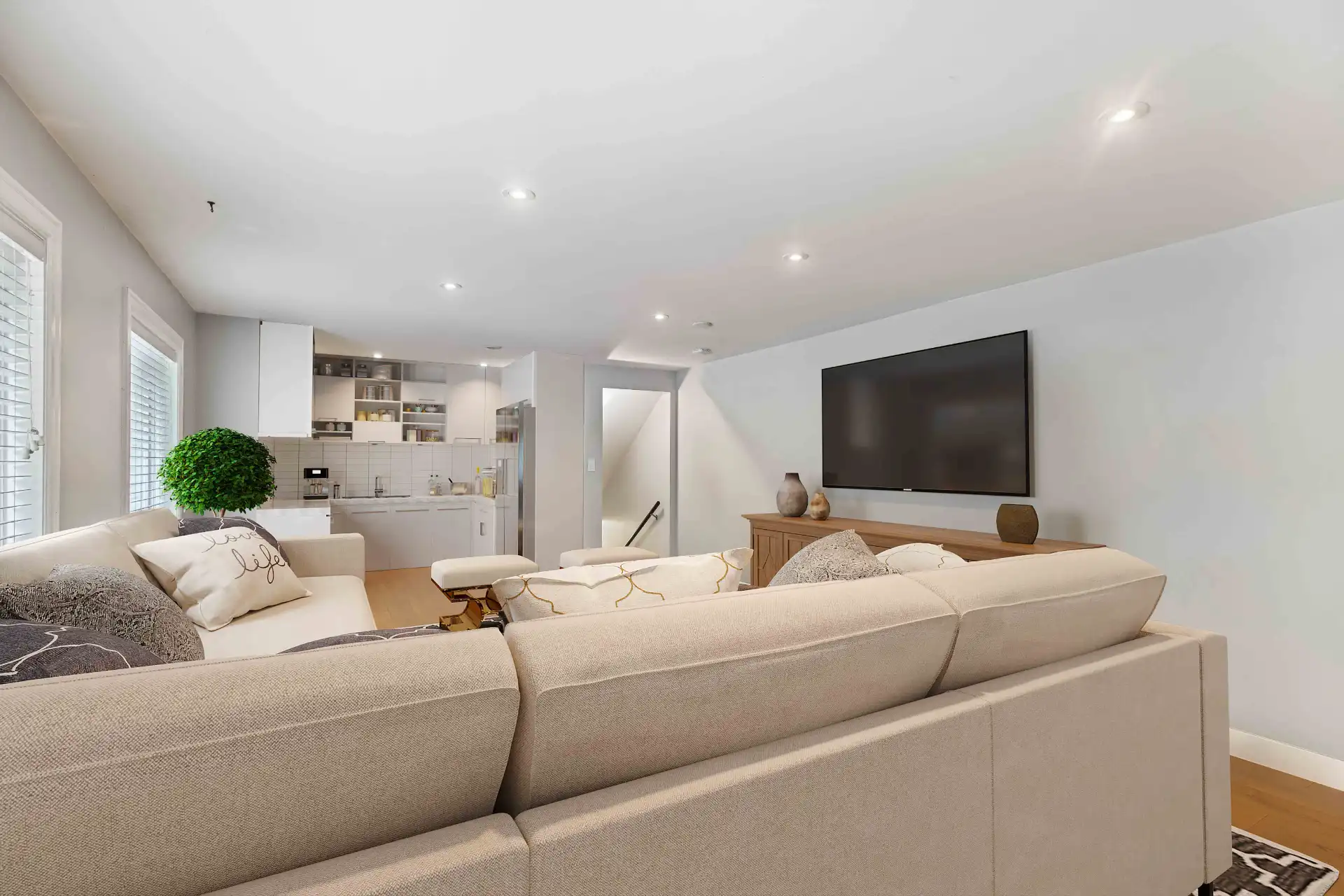 Stunning living room with floor-to-ceiling curtains, polished floors and luxury furnishings after Fotober virtual renovation