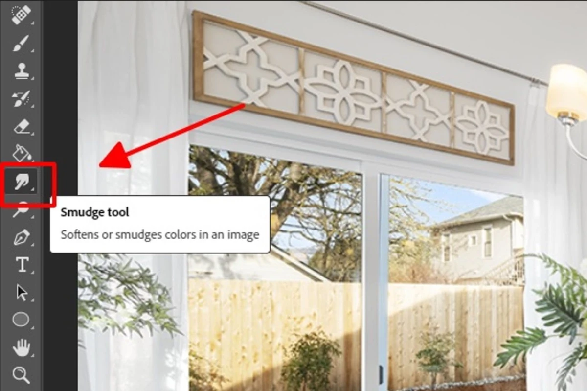 The Smudge tool lives in Photoshop's main toolbar
